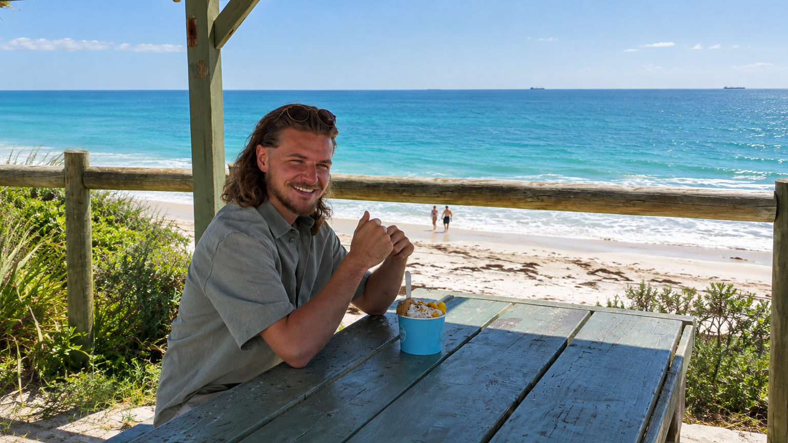 Matthew, founder of Chapters in Motion, at a beach café overlooking the ocean